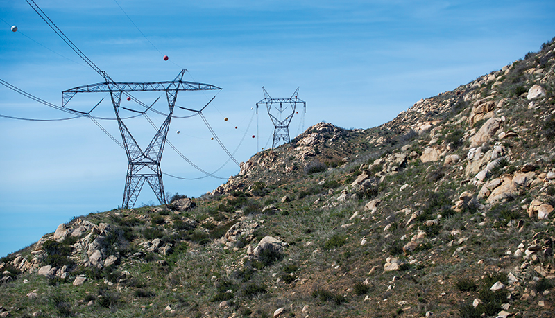 Transmission tower in rocky landscape