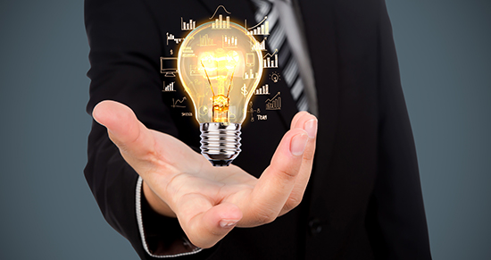 Image of outstretched palm with a light bulb