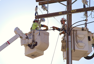 Lineman performing a daytime inspection on a power transmission line