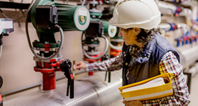 Female Engineer Checking Power Meter
