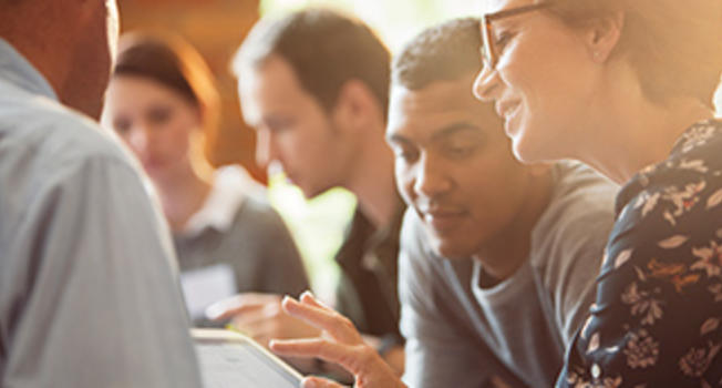 People Looking at a Tablet